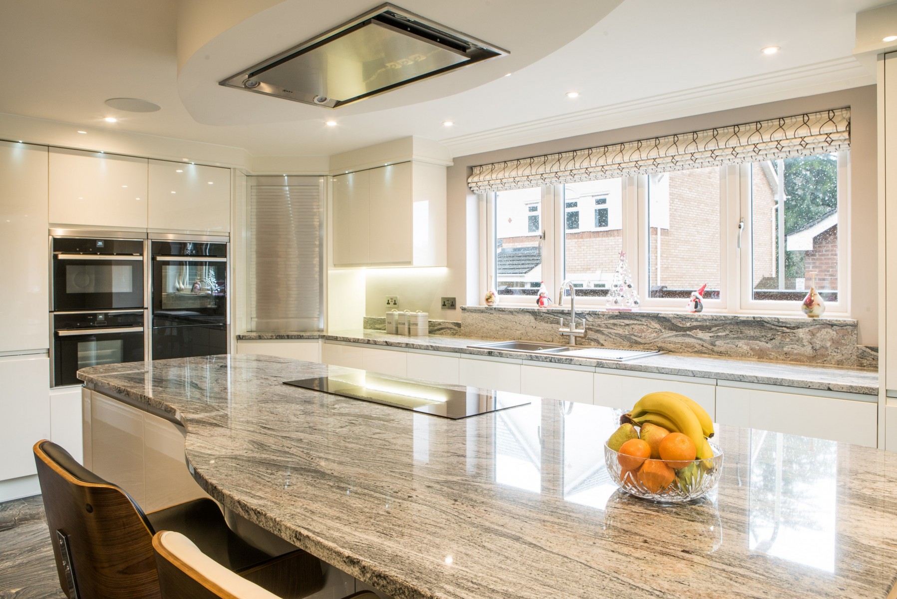 Kinawa White Granite & Baobab Ebony Limestone Kitchen. Landford Stone, Wiltshire.