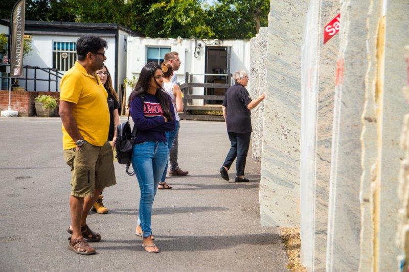 Customers looking at range of Landford Stone's stone samples