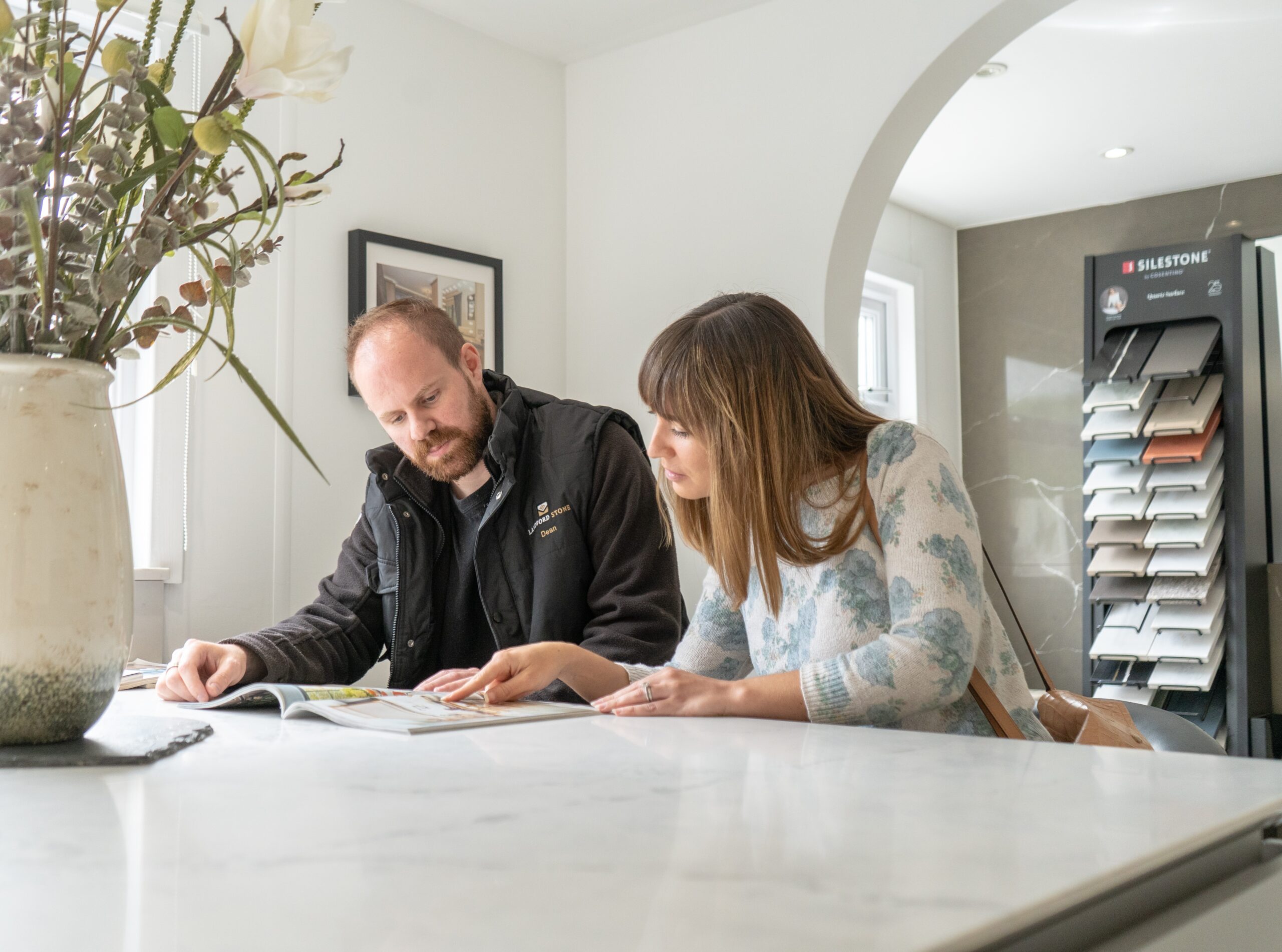 Sales assistant helping a client at Landford stone