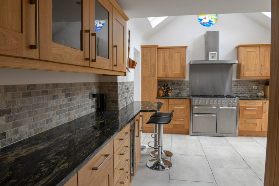 Black Cosmic Granite Kitchen. Installed by Meridian Interiors. Supplied by Landford Stone, UK.