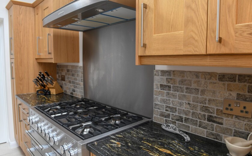 Black Cosmic Granite Kitchen. Installed by Meridian Interiors. Supplied by Landford Stone, UK.