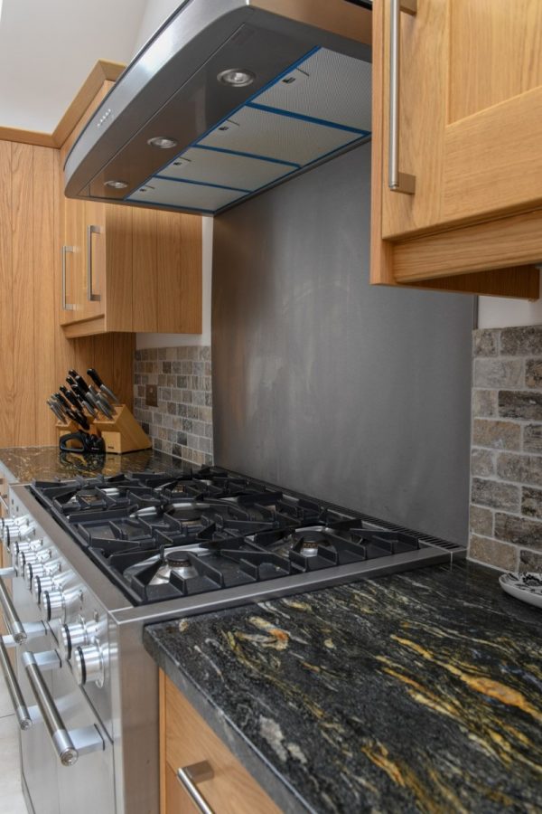 Black Cosmic Granite Kitchen. Installed by Meridian Interiors. Supplied by Landford Stone, UK.