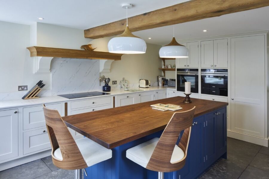 Chris Chapman white cabinets with quartz kitchen worktops, supplied by Landford Stone, Wiltshire.