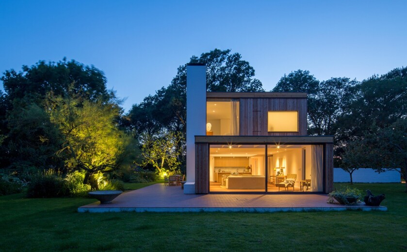 Storm Architects kitchen design through outdoor window. Quartz supplied by Landford Stone, Wiltshire.