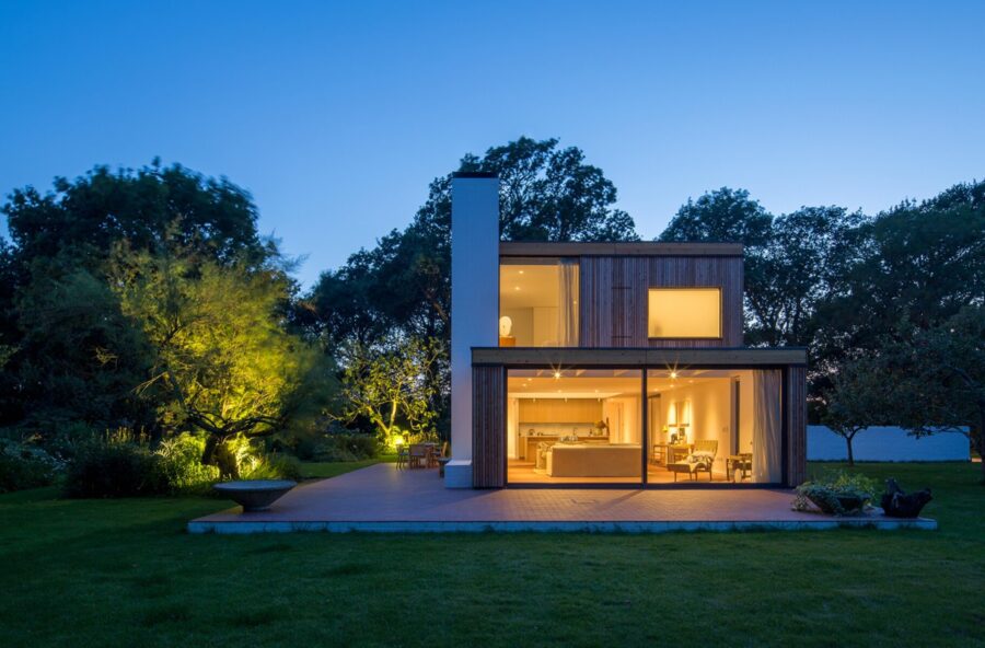 Storm Architects kitchen design through outdoor window. Quartz supplied by Landford Stone, Wiltshire.