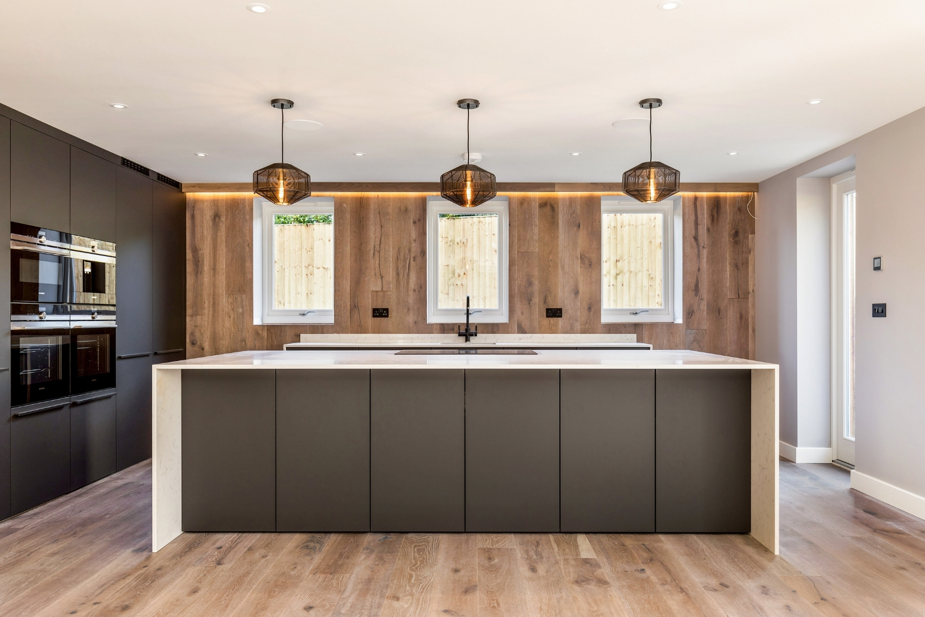 contemporary style kitchen with waterfall kitchen island